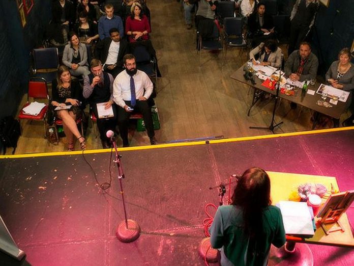 A finalist makes her pitch to a panel of judges at the annual Cubs' Lair youth entrepreneurship competition at the Gordon Best Theatre in Peterborough. (Photo courtesy of Innovation Cluster)