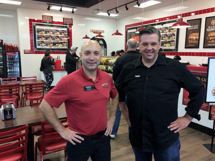 Area representative Alex Gerzon and franchisee Jason Taylor of Firehouse Subs, a new chain restaurant to Peterborough that raises funds to benefit emergency personnel. (Photo: Eva Fisher / kawarthaNOW.com)