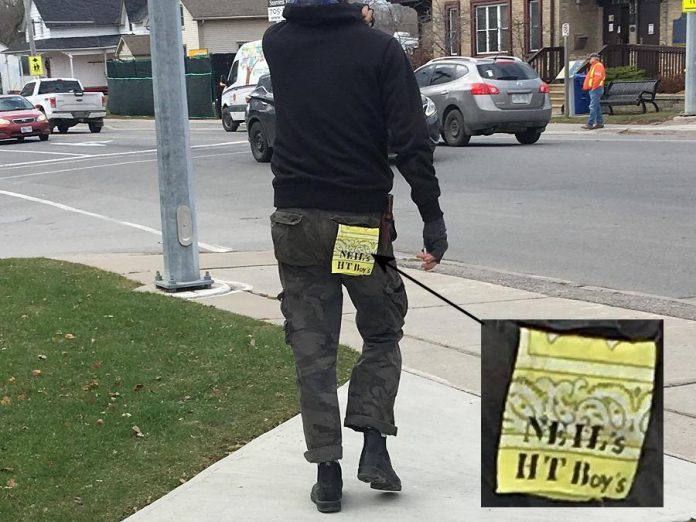 Craig Foster snapped this photo of a tag hanging from the back pocket of one of the crew unloading equipment into Coronation Hall in Omemee. (Photo: Craig Foster)