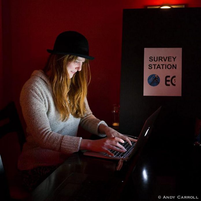 Naomi DuVall completes the Peterborough Artist Survey at a survey station located at the Sapphire Room during the Precarious Festival launch. Electric City Culture Council is collecting data from working artists living in Peterborough and the surrounding areas. (Photo: Andy Carroll)