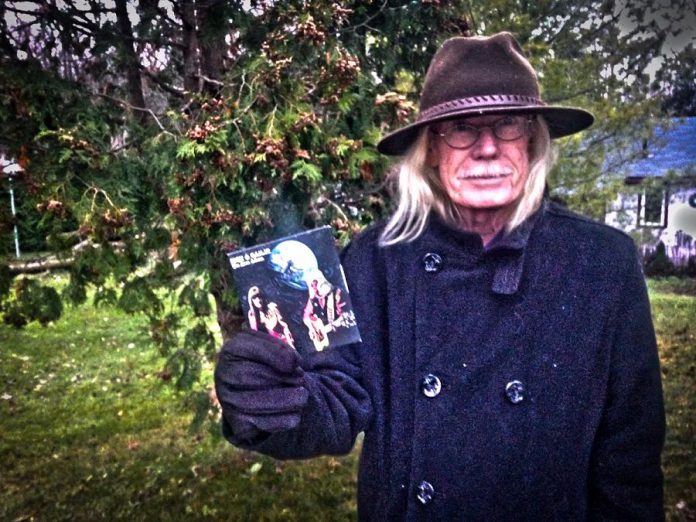 Rick Young holds a copy of "The Lost Album", Rick and Gailie's first record containing 16 original songs written by Rick. The CD was released at the benefit concert but can also be purchased online and may soon be available at Moondance in downtown Peterborough. (Photo: SLAB Productions)
