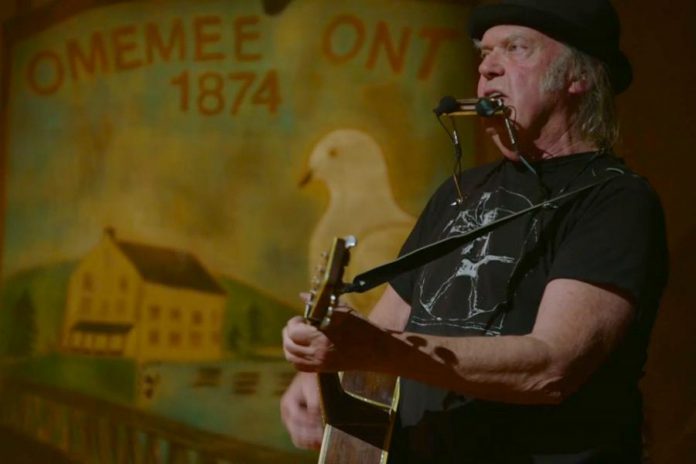 Neil Young performing at Coronation Hall in Omemee, Ontario, on December 1, 2017 as part of his "Home Town" concert that was live-streamed in Canada and around the world. Our breaking story confirming Omemee as the location for the "secret concert" was our top news story of 2017.