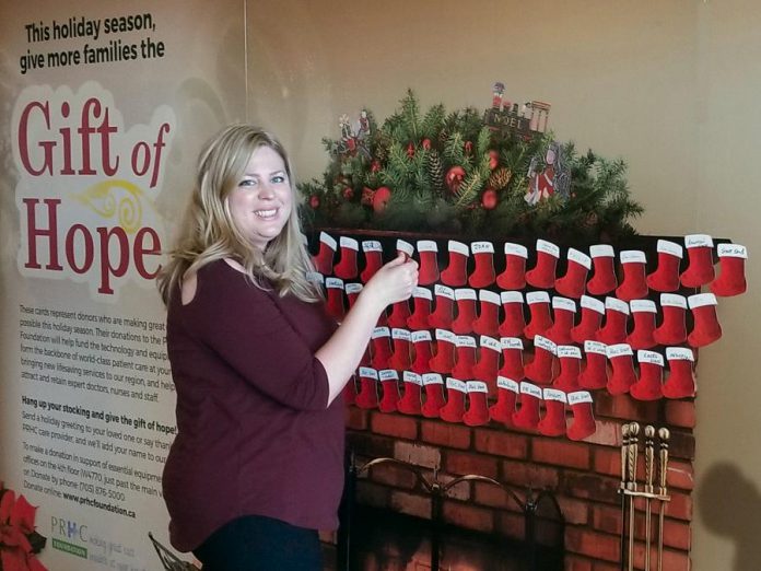 Meghan Moloney of the Peterborough Regional Health Care (PRHC) Foundation hangs a stocking on the mantel in the lobby of the hospital. Make a "Gift of Hope" donation to the PRHC Foundation this holiday season to have your stocking hung on the mantel. You can choose to make your donation in someone else's name or you can send a message of thanks to a doctor, nurse, or staff at the hospital. Your donation will help the hospital purchase lifesaving technology and equipment that makes great care possible. (Photo: PRHC Foundation)