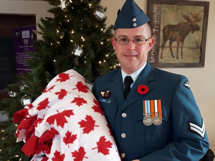 Corporal Roy receiving his soldier blanket in November 2017 from Cuddles for Cancer, which is hosting a "True Meaning of Christmas" event on Saturday, December 9th at the Cuddles Drop In location at 15 Queen Street in Lakefield. The day will begin with packing 17 boxes for Canadian soldiers who are serving overseas in Iraq, Romania, Kuwait, Ukraine, and Latvia. (Photo: Cuddles for Cancer)