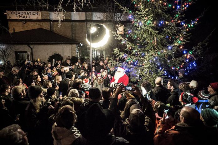 Omemee's temporary population all but tripled the night of the concert. Neil Young wasn't the only celebrity in Omemee on December 1: Santa was also there for the annual tree-lighting ceremony. Although she's not shown in this photo, actress Daryl Hannah (Neil's girlfriend and the director of the live stream) also participated in the ceremony. (Photo: Wayne Eardley)