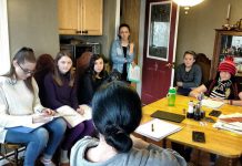 Planet 12 Productions director, writer, and co-founder Derek Weatherdon (with his back to the camera) during a kitchen meeting with the company's six talented young performers: Aimee Gordon, Emma Meinhardt, Emily Keller, Abbie Dale, Isaac Maker, and Samuelle Weatherdon. The company is staging a new version of "The Reluctant Dragon" for local schools and will be taking "Boy Wonders" to the Toronto Fringe Festival in 2018. (Photo: Sam Tweedle / kawarthaNOW.com)