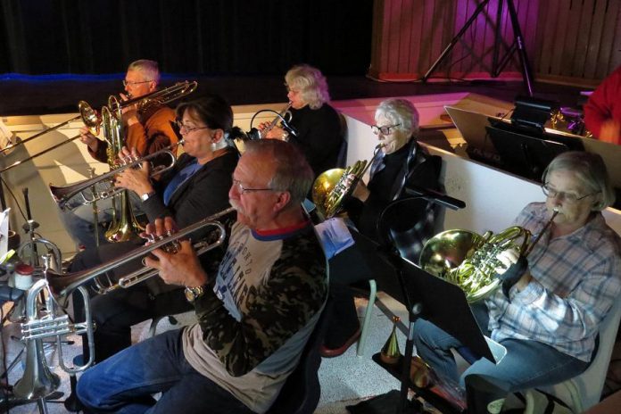 A full orchestra of volunteer musicians under the direction of Ben Jackson with assistance by Justin Hiscox provide the musical accompaniment for the performers. (Photo: Celia Fehr)