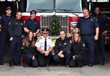 Scott Lawder, Brad Luby, Mark Sullivan, Amanda Nichols, Chief Snetsinger, Ed Venuk, Jaclyn Finney, Joe Cadigan, and Patrick Wayne of the Peterborough Professional Firefighters Association, pictured in 2016. Once again this year, the association will be donating money to the annual Salvation Army Toy Drive as well as to the Salvation Army hamper fund, and will help transport the toys and distribute the hampers. (Photo courtesy of Peterborough DBIA)