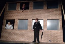 In "7 Stories", a man stands on the ledge of a building contemplating suicide while an oddball cast of characters speaks to him through apartment windows. Pictured are Kelsey Morewood as Leonard, Lori Branch as Jennifer, and Drew Mills as The Man in Anne Shirley Theatre Company's production of Morris Panych's black comedy. (Photo: Sam Tweedle / kawarthaNOW.com)