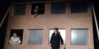 In "7 Stories", a man stands on the ledge of a building contemplating suicide while an oddball cast of characters speaks to him through apartment windows. Pictured are Kelsey Morewood as Leonard, Lori Branch as Jennifer, and Drew Mills as The Man in Anne Shirley Theatre Company's production of Morris Panych's black comedy. (Photo: Sam Tweedle / kawarthaNOW.com)