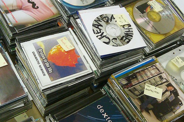 A stack of CDs submitted during the 2010 international RPM Challenge. (Photo: RPM Challenge)