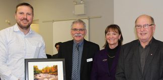 Andrew Winslow of Winslow Gerolamy Motors Limited (left) accepts the Environmental Excellence Business Award from Ontonabee Conservation at its 59th annual meeting on January 18, 2018. Winslow Gerolamy Motors donated a cube van to the environmental organization for use in transporting tree seedlings. (Photo: Otonabee Conservation)