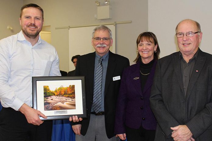 Andrew Winslow of Winslow Gerolamy Motors Limited (left) accepts the Environmental Excellence Business Award from Ontonabee Conservation at its 59th annual meeting on January 18, 2018. Winslow Gerolamy Motors donated a cube van to the environmental organization for use in transporting tree seedlings. (Photo: Otonabee Conservation)