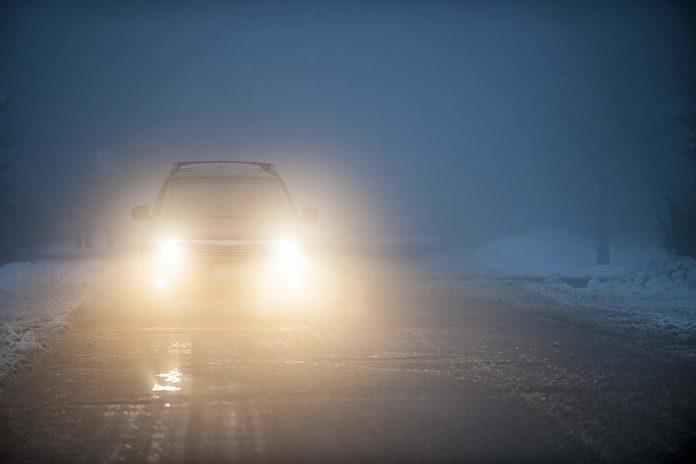 Car headlights in fog