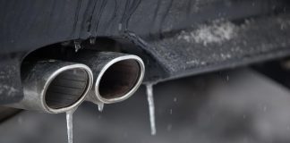 Car tailpipe in winter