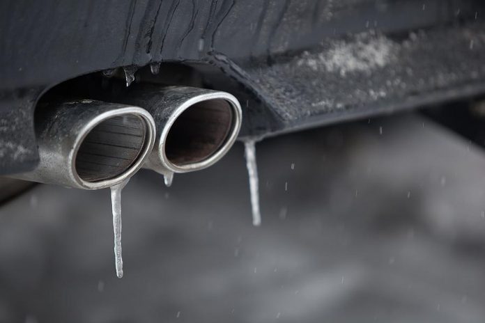 Car tailpipe in winter