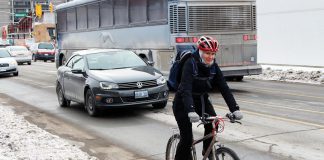 GreenUP's Jenn McCallum cycling to work in the winter. Winter weather can be chilly and windy, but why not try ditching the car and choosing a more healthy and active way to get to work? You can also save a lot of money by choosing active transportation instead of driving. (Photo: GreenUP)