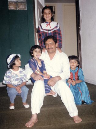 "My daughter is going to graduate from a top university someday." Samra Zafar (top) at age seven with her father and three of her younger sisters at their Abu Dhabi home in the United Arab Emirates. (Photo courtesy of Samra Zafar)
