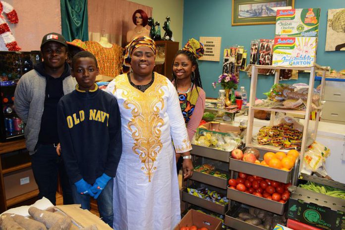 Michael Obidey, Moses Adebamiro, Tokunbo Deborah Adebamiro, and Bukola Esther Adebamiro of African Mission-Growth Market are bringing Nigerian and Ghanaian food and clothing to Peterborough. (Photo: Eva Fisher / kawarthaNOW.com)