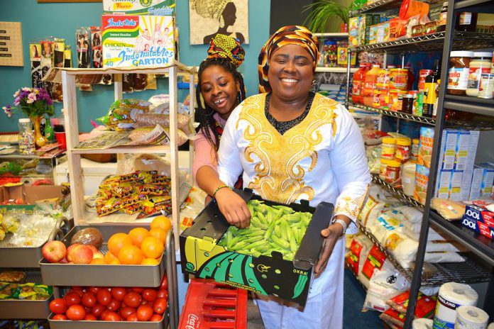 African Mission-Growth Market is bringing a taste of Africa to Peterborough. The Simcoe Street shop, run by Tokunbo Deborah Adebamiro (right), offers fresh produce like okra and yams. Tokunbo suggests blending the okra to make a soup. (Photo: Eva Fisher / kawarthaNOW.com)