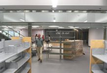 The renovated Peterborough Public Library features a new children's books area on the lower level, with a central staircase connecting to the main level. The open concept design features lots of natural light coming from the glass windows at the front of the library. (Photo: Peterborough Public Library)