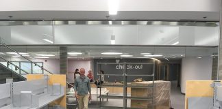 The renovated Peterborough Public Library features a new children's books area on the lower level, with a central staircase connecting to the main level. The open concept design features lots of natural light coming from the glass windows at the front of the library. (Photo: Peterborough Public Library)