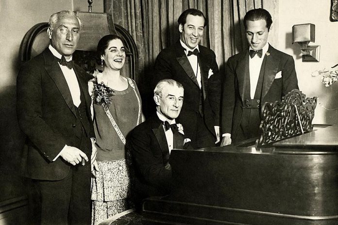 American composer George Gershwin (right) at a birthday party honoring Maurice Ravel (at the piano) in New York City on March 8, 1928. (Photo: Wikipedia)