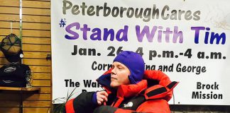 Deputy Police Chief Tim Farquharson trying on some winter weather gear at Wild Rock in downtown Peterborough. Farquharson will be spending a night outside on January 26, 2018 to raise awareness of the plight of the homeless, as well as raise money for YES Shelter for Youth and Families, Brock Mission, and The Warming Room. (Photo courtesy of Peterborough Cares)