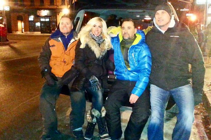 Deputy Police Chief Tim Farquharson (left) with Lindsay Mitchell, Camille Parent, and Tim Burke of Peterborough Cares at the corner of King and George streets in downtown Peterborough during the night of January 26th. The "Stand With Tim" fundraiser raised more than $10,000 for three Peterborough homeless shelters. (Photo: Matthew Stewart / Instagram)