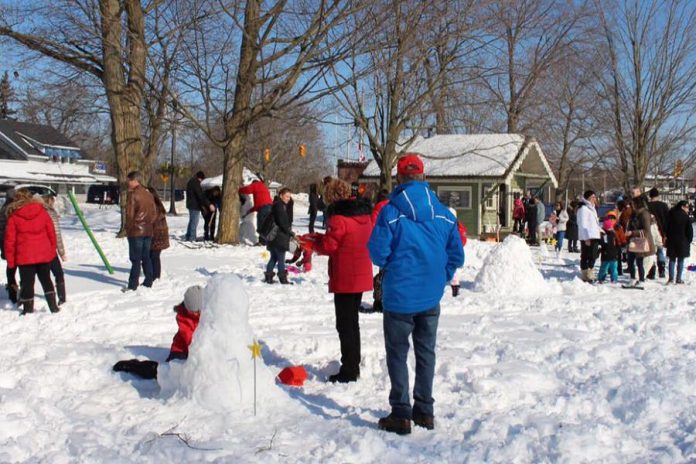 Attendees at last year's FrostFest enjoyed hot chocolate and homemade cookies donated by local businesses and volunteers, while Impact 32 volunteers ran fun games with prizes for every child, and mascot "Bobbie Constellation" circulated among the crowds. (Photo courtesy of Impact 32)