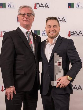  Deputy Mayor John Henderson, on behalf of Mayor Gil Brocanier, presents The Mayor's Award to Aiden Rose, accepting on behalf of his father Al Rose of Stalwood Homes.  (Photo: Northumberland Central Chamber of Commerce)