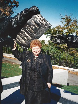 After receiving the Governor General's Award in Commemoration of the Person's Case in October 2001, Linda Silver Dranoff stands with the Parliament Hill statue of the Famous Five:  five Alberta women who in 1927 sought to have women legally considered persons so they could be appointed to the Senate. (Photo courtesy of Linda Silver Dranoff)