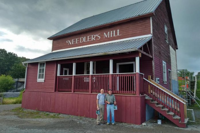 John Spencer and Joe Lunn (who used to work at the mill when it was operational) sanding down and restoring the exterior of the historic Needler's Mill in August 2017. On February 23, 2018, Needler’s Mill will officially become the property of the Millbrook and Cavan Historical Society when representatives from the society and Otonabee Conservation sign the official agreement at a public gathering in the Legion Hall. Once the work on the Millbrook Dam is completed, the society and Otonabee Conservation will be designing and installing interpretive historical panels beside the mill. (Photo: Save the Dam Mill Pond / Facebook)