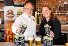 Marty Laskaris, co-founder and president of Publican House Brewery, with Carolyn Hyslop, general manager of The Canadian Canoe Museum. Publican House Brewery has raised $7,289 for the museum through sales of its Paddler's Ale. (Photo courtesy of The Canadian Canoe Museum)