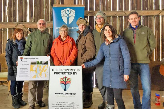 Property owner Mieke Schipper (third from left) has donated a conservation easement agreement to the Kawartha Land Trust (KLT) to protect the family's 100-acre Pigeon Lake property, home of the Gamiing Nature Centre, in perpetuity. Also pictured (left to right): Eva Kennedy, KLT Board of Directors; Ian Attridge, KLT Volunteer; Amy Elliott, Gamiing Nature Centre Board of Directors; Thom Unrau, KLT Land Stewardship Coordinator; Tara King, KLT Development Coordinator; and Mike Hendren, KLT Executive Director. (Photo courtesy of Kawartha Land Trust)