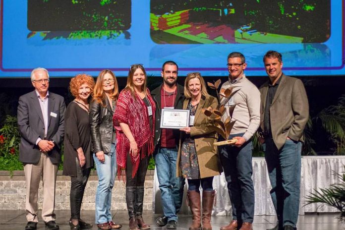 Robin Burrows, owner of Gilstorf & Gray of Bobcaygeon (fourth from left), with lead designer Julie Moore of Modern Landscape Designers (holding the plaque) and other team members accepting the "Tony Di Giovanni Award – Judges Choice Garden of the Year 2018" from Canada Blooms officials. (Photo: Modern Landscape Designers)