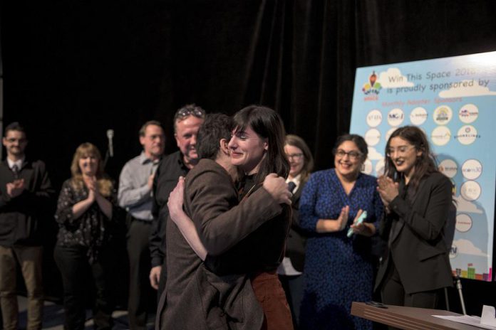 Nadine McCallen celebrates winning the 2018 Win This Space entrepreneurial competition at The Venue in downtown Peterborough on March 1, 2018. (Photo courtesy of Peterborough DBIA)