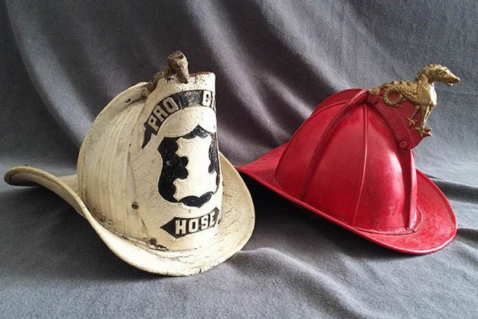 Two vintage leather firefighters' helmets. (Photo: Canadian Fire Fighters Museum)