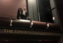 David Goyette with his wife Victoria Pearce above the sign at Showplace Performance Centre proclaiming The David Goyette Stage. Pearce and Goyatte, who already has the naming rights for the theatre's green room from an earlier donation, made a 10-year financial contribution non-profit performance venue to secure the naming rights for the stage located in the main theatre, allowing the non-profit venue to purchase a new lighting console. (Photo: Showplace Performance Centre)