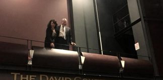 David Goyette with his wife Victoria Pearce above the sign at Showplace Performance Centre proclaiming The David Goyette Stage. Pearce and Goyatte, who already has the naming rights for the theatre's green room from an earlier donation, made a 10-year financial contribution non-profit performance venue to secure the naming rights for the stage located in the main theatre, allowing the non-profit venue to purchase a new lighting console. (Photo: Showplace Performance Centre)