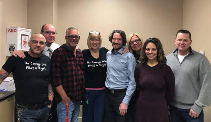 Ontario’s first legal temporary overdose prevention site opened in London on February 12, 2018. Pictured is Dr. Chris Mackie, Medical Officer of Health with the Middlesex-London Health Unit (fifth from left) with health unit staff and members of the London Regional HIV AIDS Connection. (Photo: Middlesex-London Health Unit / Facebook)