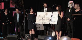 PetSmart Charities of Canada donated $161,000 to the Peterborough Humane Society at the shelter's annual fundraising gala on February 24, 2018. Pictured from left to right: OSPCA CEO Kate MacDonald, OSPCA senior director Daryl Vaillancourt, PHS board chair Nicole Truman, PHS executive director Shawn Morey, PetSmart Peterborough's Star Shaw, gala emcee Ray Henderson (in costume), and Pet Smart Peterborough, Ray Henderson MC, amd PetSmart Charities regional relationship manager Dani Mailing. (Photo courtesy of Peterborough Humane Society)