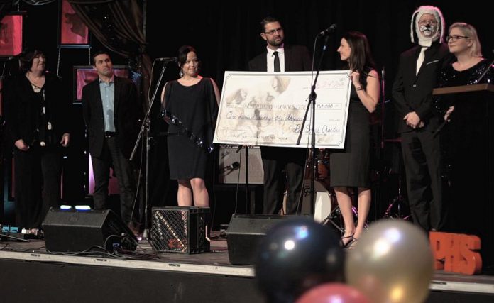 PetSmart Charities of Canada donated $161,000 to the Peterborough Humane Society at the shelter's annual fundraising gala on February 24, 2018. Pictured from left to right: OSPCA CEO Kate MacDonald, OSPCA senior director Daryl Vaillancourt, PHS board chair Nicole Truman, PHS executive director Shawn Morey, PetSmart Peterborough's Star Shaw, gala emcee Ray Henderson (in costume), and Pet Smart Peterborough, Ray Henderson MC, amd PetSmart Charities regional relationship manager Dani Mailing. (Photo courtesy of Peterborough Humane Society)