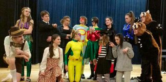 The cast of Enter Stage Right's original production "After the Battle", which runs from April 25 to 28 at the PCVS Auditorium in Peterborough. From left to right, back to front: Taite Cullen as The Wave, Isaac Martin as The Bureaucrat, Britney Burton as Madison Clark, Joel Alexander as The Guy in the Mask, Lydia Etherington as The Get It Girl, Elen Gaqollari as Masterplan, Amy Daye as Eye Candy, Ceilidh Peters, Katey Cliff, Shayne Fertile, Lena Ross as Appleonia, Antje Kroes as The Multi-Purpose Marauder, Jordan de Groot as The Gooch. and Lauren Wilson as Snitchy. (Photo: Sam Tweedle / kawarthaNOW.com)