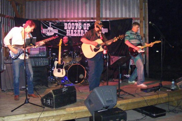 Country rock band Boots of Hazard is Dennis Carmichael (bass/vocals), Gavin Gartshore (drums/vocals), Craig Stacey (guitar/vocals), and Dennis Carmichael (guitar/vocals). The band released its first single "Muddy Water" in July 2017 and is working on a full-length album for release next year. (Photo courtesy of Boots of Hazard)