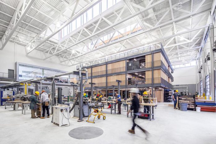 The Skills Arena and the Kube are flexible and integrated learning spaces at Fleming College's Kawartha Trades and Technology Centre (KTTC). The American Institute of Architects has recognized KTTC, designed by Perkins+Will, with a 2018 Education Facility Design Award. (Photo: Scott Norsworthy)