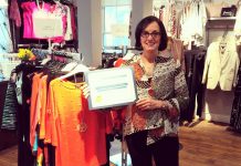 Style Boutique, a women's clothing store in Bridgenorth, recently celebrated its 10th year in business. Owner Diana Carter poses with a congratulatory plaque delivered by Selwyn Township Mayor Mary Smith. (Photo: Style Boutique / Facebook)