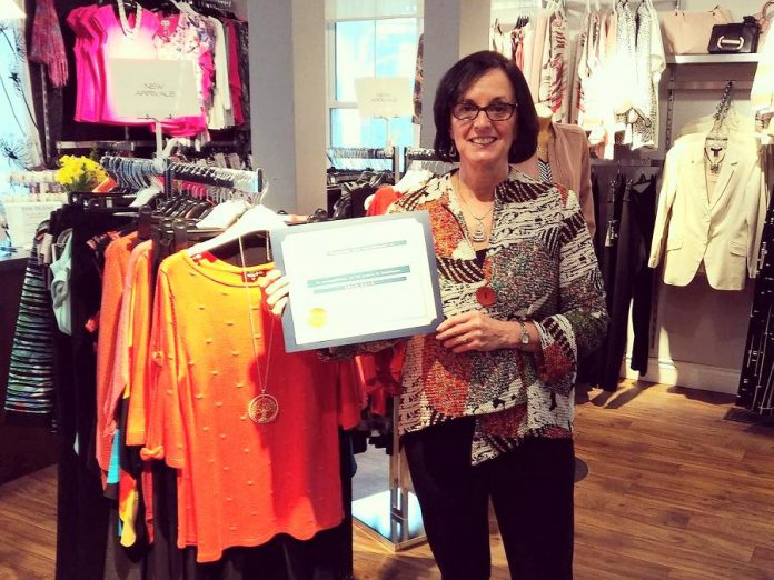 Style Boutique, a women's clothing store in Bridgenorth, recently celebrated its 10th year in business. Owner Diana Carter poses with a congratulatory plaque delivered by Selwyn Township Mayor Mary Smith. (Photo: Style Boutique / Facebook)