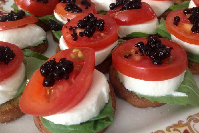 Fresh mozzarella with tomato, basil, and balsamic pearls. (Photo: Shari Darling)