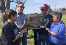 A plaque honouring the late Bill "Mr. Slo-Pitch" Bowers was unveiled Wednesday morning (May 2) in Bowers Park off Brealey Drive in Peterborough. Among those remembering Bowers' milestone contributions to the game at the local, provincial and national were (from left) City of Peterborough recreationist Terry Lynn Johnston, Bowers' son Dan (who travelled from North Dakota for the dedication), and his close friends and Peterborough Slo-Pitch Association colleagues Bob and Maureen Lewis. (Photo: Paul Rellinger / kawarthaNOW.com)